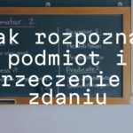 A chalkboard with Polish grammar rules, highlighting subject and predicate, educational setting, clear and simple, illustrative.