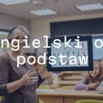 A cheerful teacher holding an English alphabet chart, smiling students in a bright classroom, educational vibe, warm lighting, realistic.